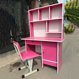 Bàn học sinh liền giá sách màu hồng